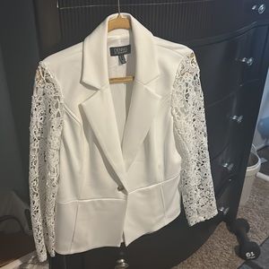 White Jacket with crochet sleeves and pockets.